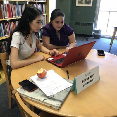 Two female students study in 正规赌篮球的软件's library