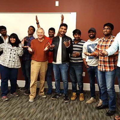 International students pose with faculty member Rick Mitchell